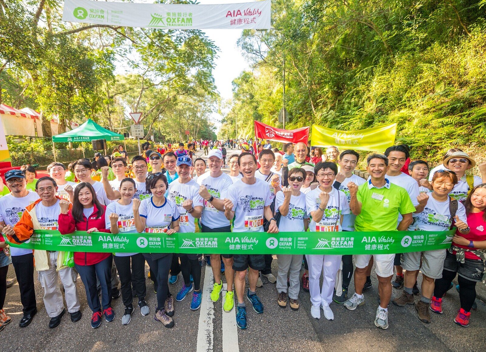 Close to 30 business leaders, including Bernard Chan, Oxfam Trailwalker Advisory Committee Chair (first row, eighth from the left); Cheung Yuk-Tong, Council Chair of Oxfam Hong Kong (first row, third from the right); Peter Crewe, Chief Executive Officer of AIA Hong Kong & Macau (first row, sixth from the right); Bonnie Tse, General Manager, Business Strategy and Marketing, AIA Hong Kong & Macau (first row, third from the left); and Jim Jan Zen, Chief Agency Officer, Agency Distribution, AIA Hong Kong & Macau (second row, sixth from the left), joined the ‘Oxfam Trailwalker 2017 – Leaders Against Poverty Walk’ on the first day of the event. AIA Vitality is the Principal Sponsor of Oxfam Trailwalker 2017.