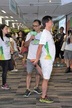 Frank Hung, from the Hong Kong Physiotherapy Association - Sports Specialty Group, did warm up exercise with Dr. Kenneth Wu (pictured left).