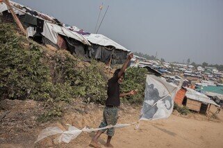 In November 2017, we met Abir who was flying a kite on a hill. He made the kite with his friend using a tin can as the spool, bamboo kite sticks, and string. They also cut a plastic bag that had a celebrity on it to make the kite, which made it rather eye catching in the sky. (Photo: Ko Chung Ming/Oxfam)