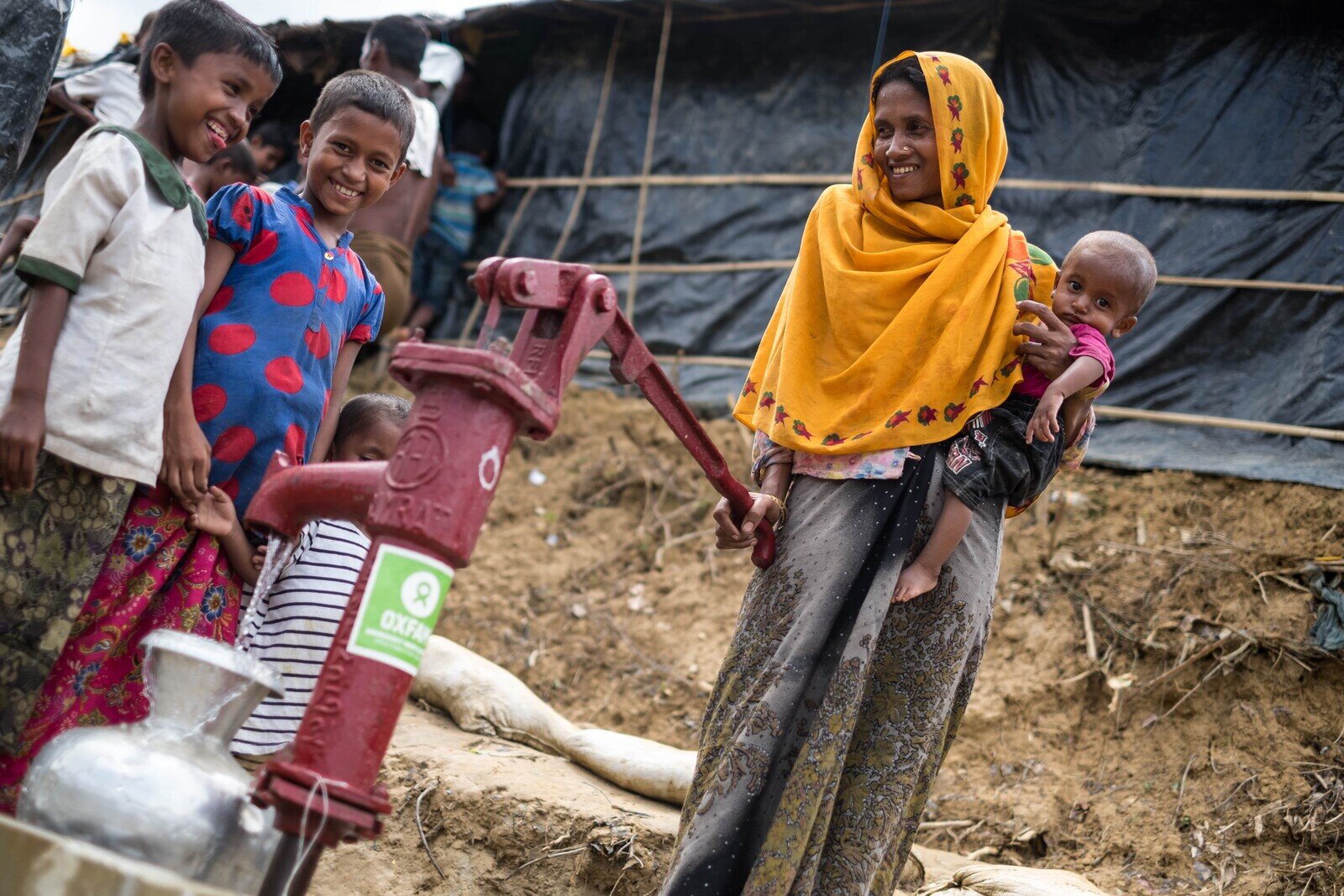 Sumania lives in Moinnarghona Camp in Bangladesh with her seven children. Oxfam recently installed latrines and water pumps in the camp making life more convenient for people like Sumania as she now lives just a short distance away from a latrine and a water pump. (Photo: Bekki Frost/Oxfam)