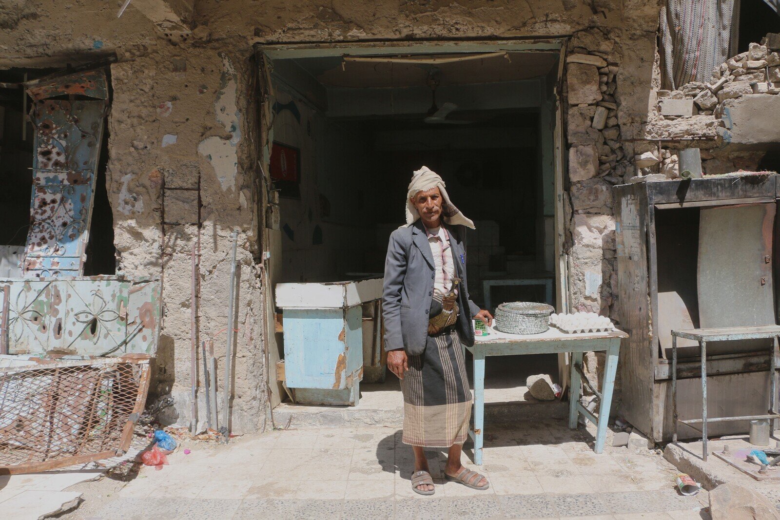 Ahmed Al-Haj stands outside his cafeteria in Taiz city. He closed his business during heavy clashes but has decided to re-open the café in order to earn an income. Taiz traders told Oxfam that they will be forced to close their shops and leave for more accessible areas if the situation does not improve in March.