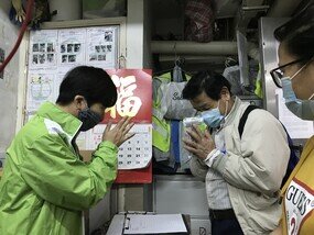 Cleaners at the Lan Kwai Fong Refuse Collection Point – many of whom were Nepalese – showed their appreciation after receiving masks. 